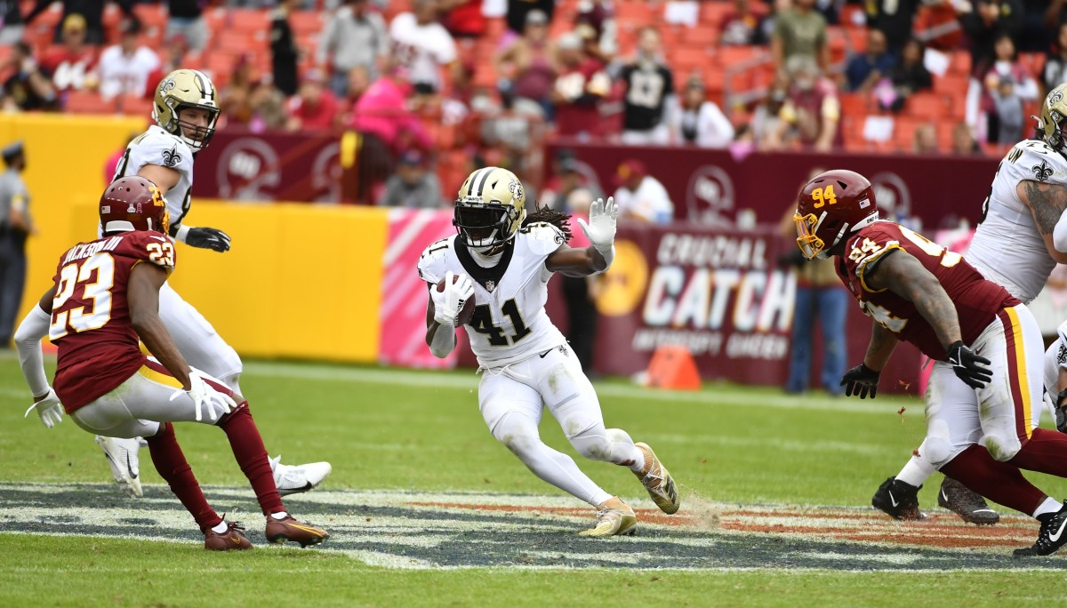 New Orleans Saints running back Alvin Kamara (41) rushes between Washington defendersWilliam Jackson (23) and Daron Payne (94). Mandatory Credit: Brad Mills-USA TODAY Sports